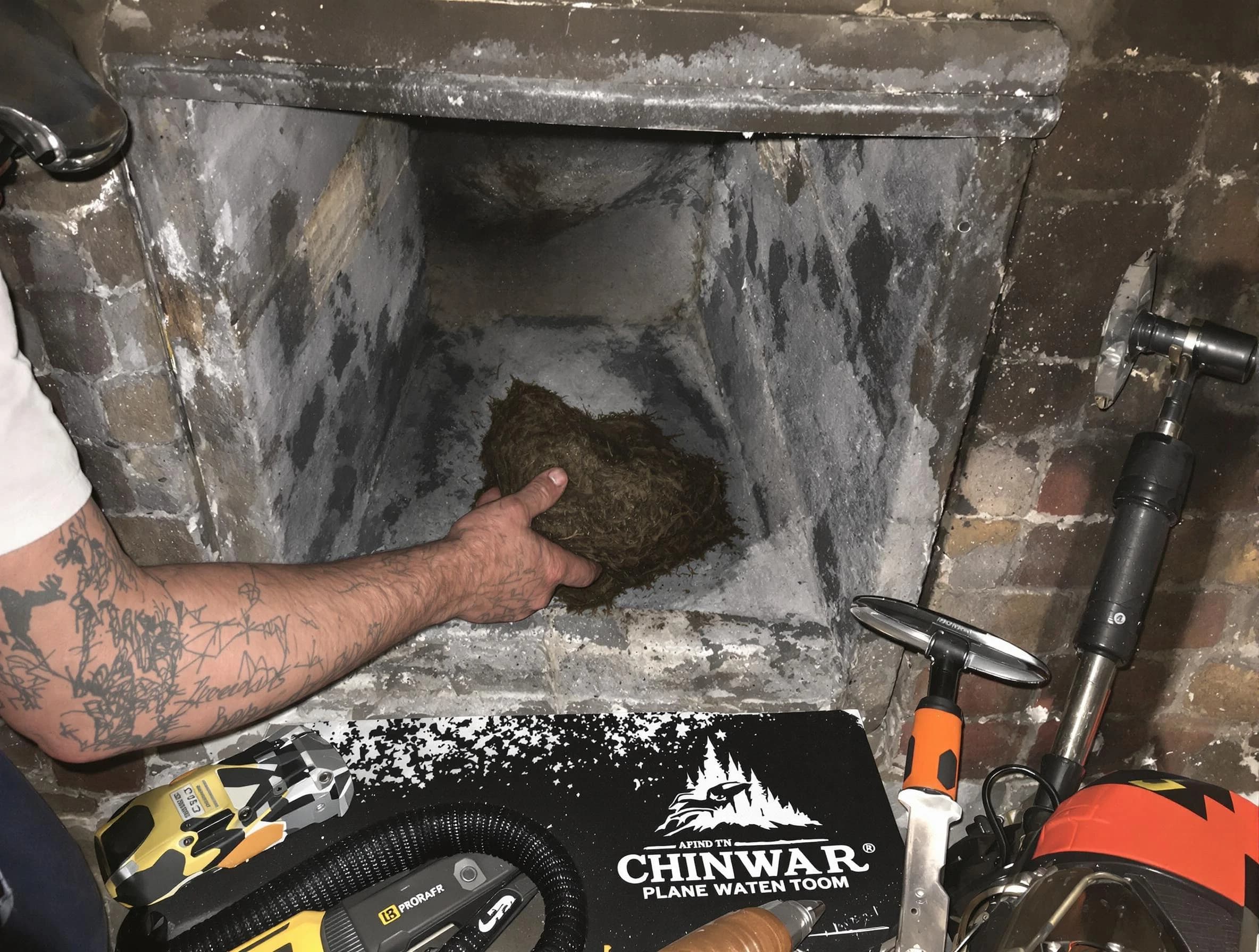 North Huntingdon Chimney Sweep safely removing debris and screening chimney in North Huntingdon, PA
